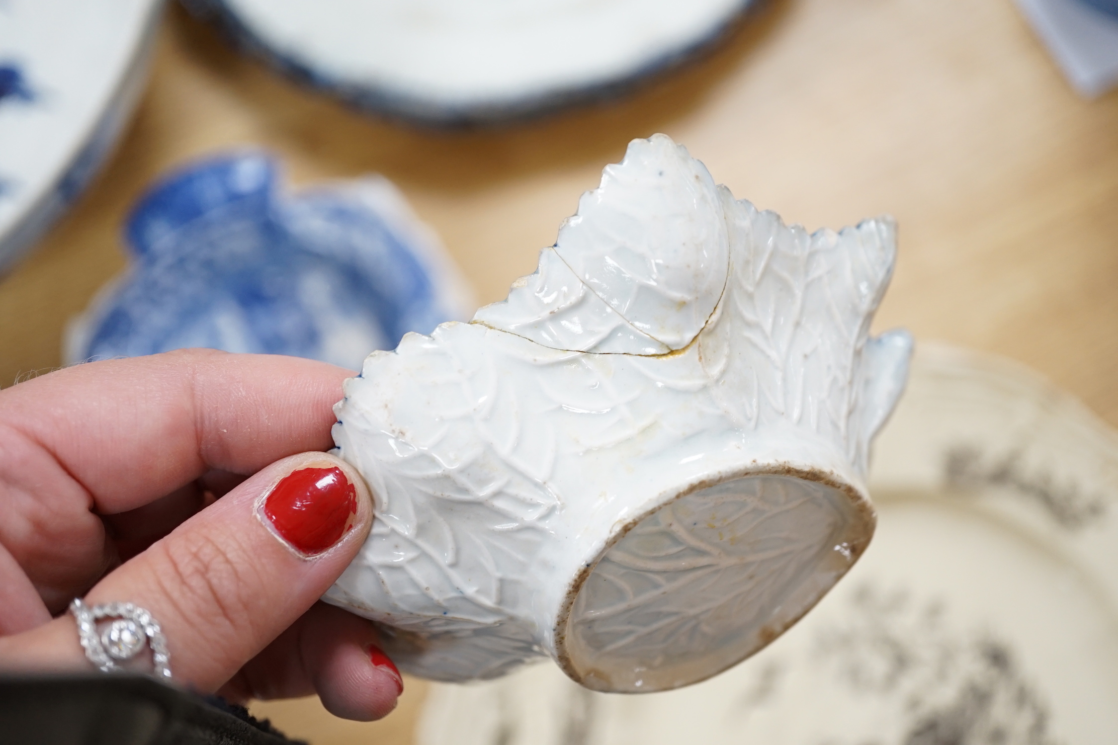 A collection of late 18th/early 19th century pearlware and creamware including three black transfer printed creamware plates, c.1780, blue and white bowls, plates, dishes and jug, the largest 27cm in diameter